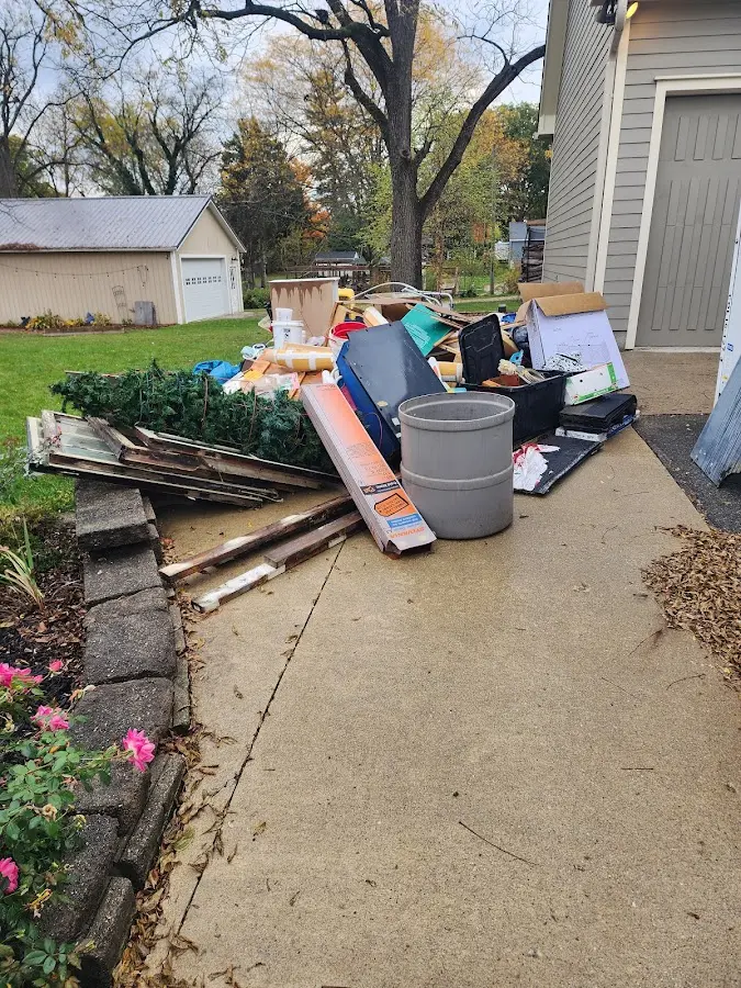 Dumpster being loaded with debris for Residential Dumpster Rental in Cambridge